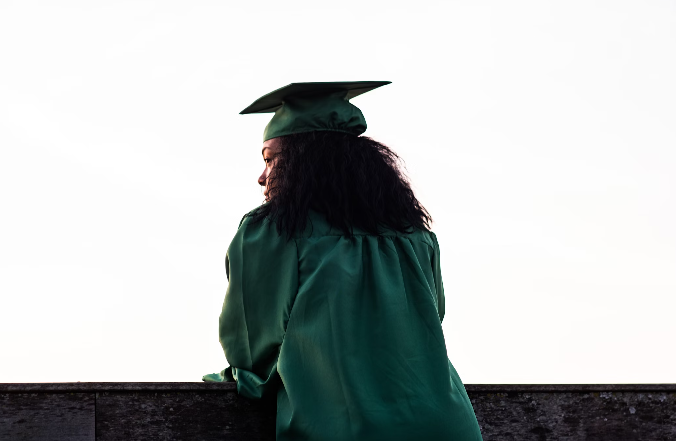 College Graduate looking into horizon contemplating