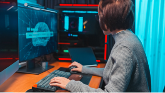 Futuristic image with human interacting with advanced computer