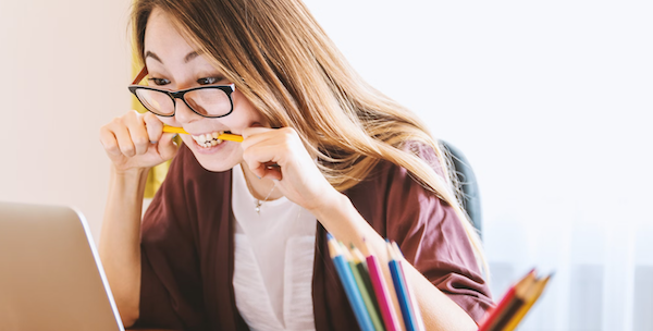 Frustrated student chewing on a pencil